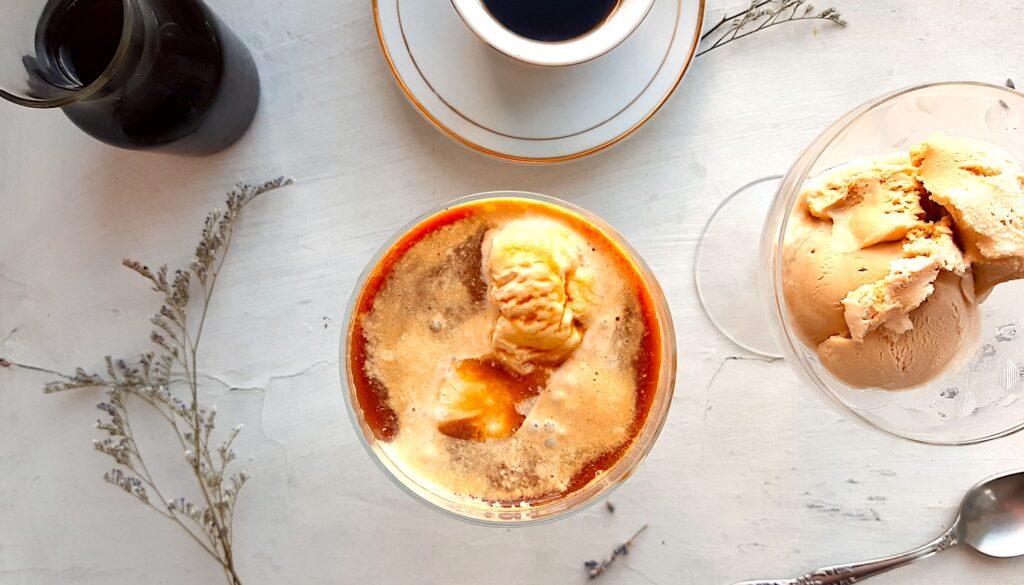 Affogato coffee with ice cream on a glass cup Grey slate background Food  Images